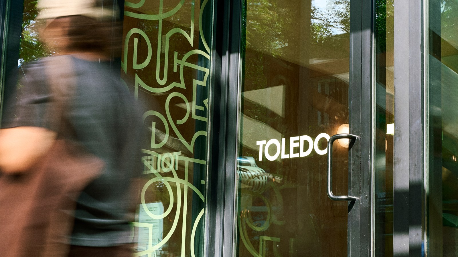 The Toledo storefront shows how the identity lives in signage and patterned glass. Design: Nouvelle idée.