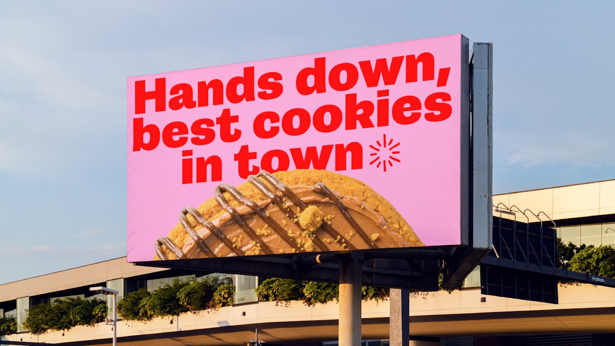 &Cookies outdoor billboard with bold red typography and product photograph