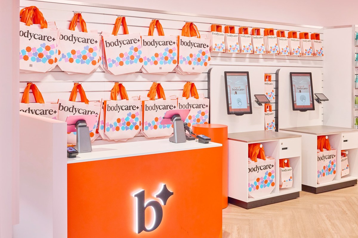 Bodycare relaunch store with warm orange counters and new signage